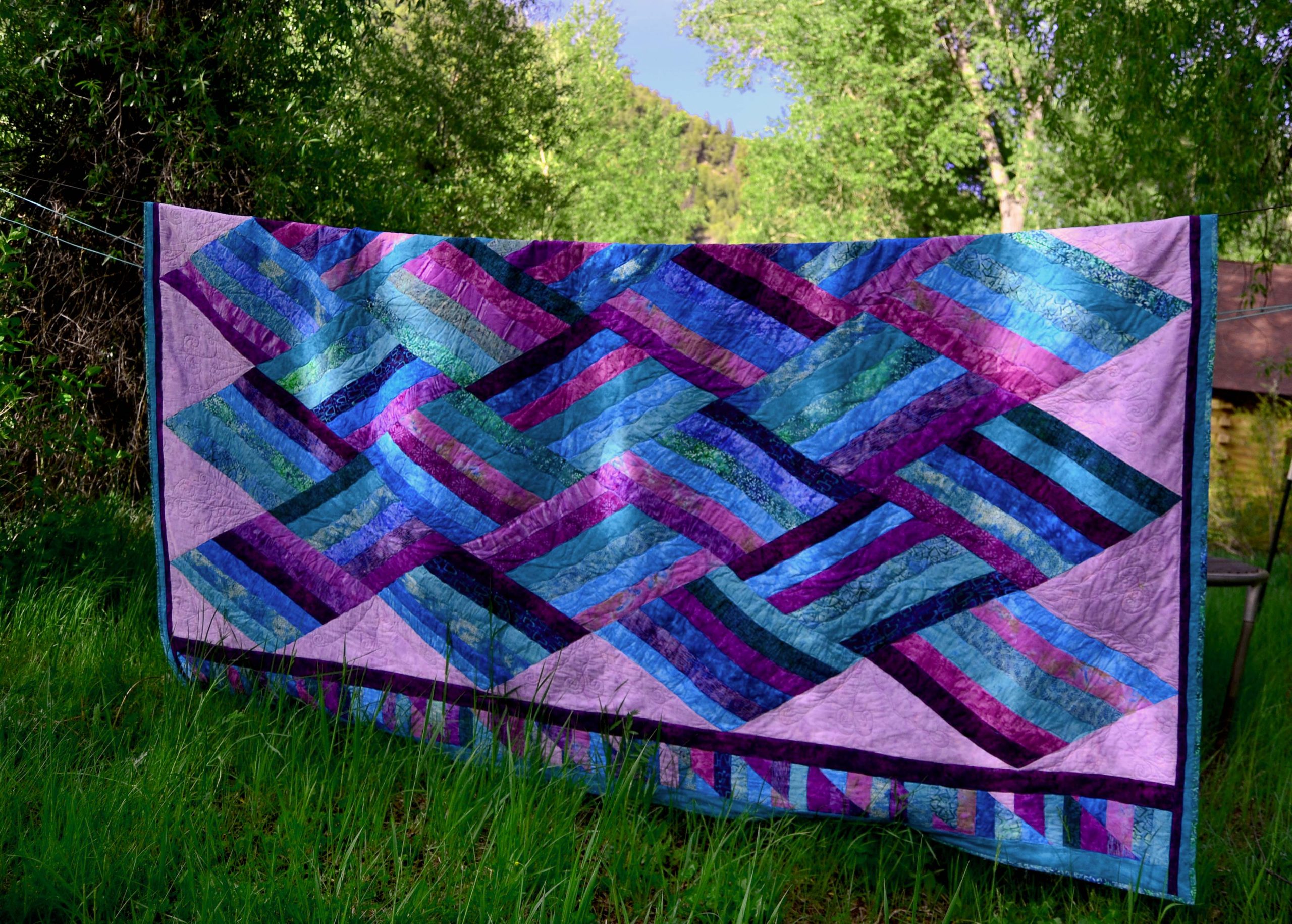 blue, purple and aqua quilt called Twilight Tide