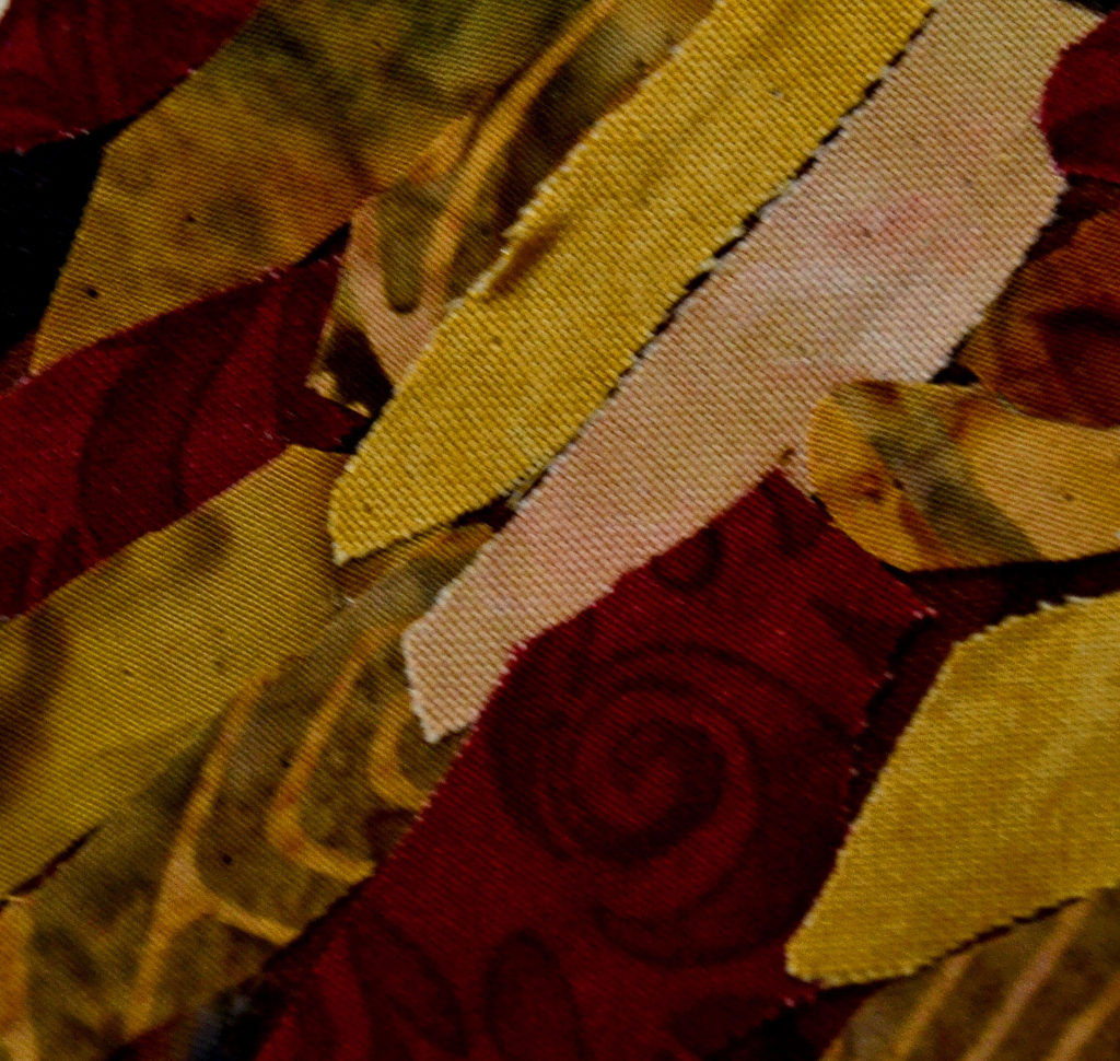 Layered fabrics mostly beautiful batiks in ivory cream to dark red shades