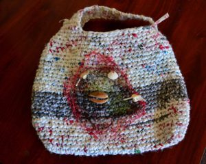 white and gray plastic hand crocheted bag using Mexican seashells