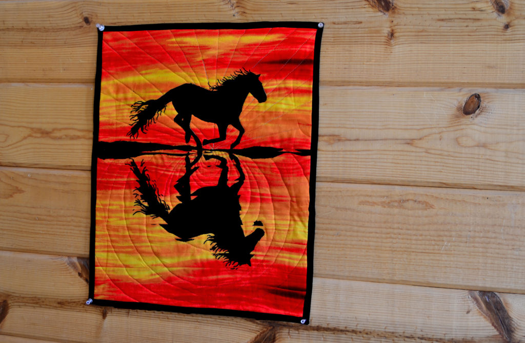 Running wild black horse sunset wall hanging quilt