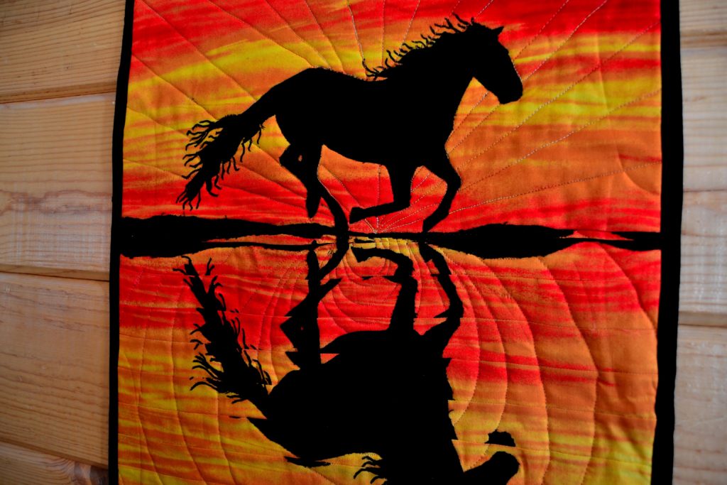 Running wild black stallion on the beach at sunset, black, orange, gold, red fabric art interior wall art