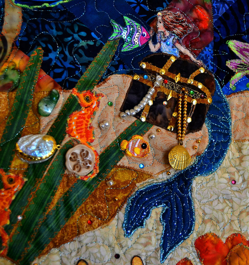 Quilted mermaid with a treasure chest in a coral reef panel