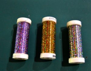 Irridescent purple, gold, and silver holoshimmer metallic thread