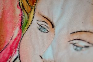 Eye of a fairy quilted with silver metallic thread