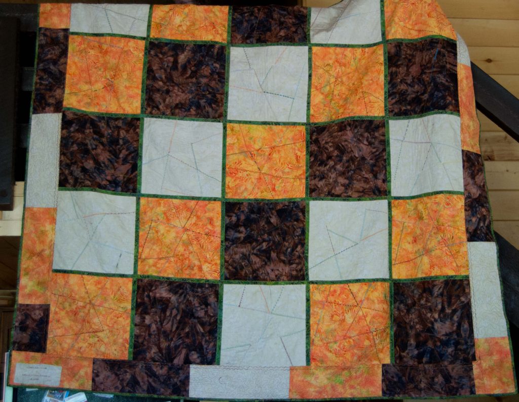 brown, orange, and cream checkered quilt backing