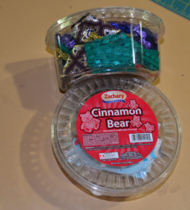 Plastic candy tubs are used to hold specialty ribbons