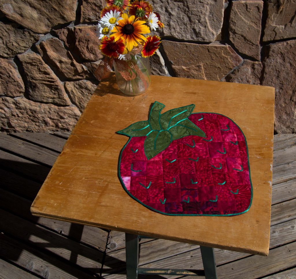 Strawberry place setting or table topper - bargello quilted fabric art