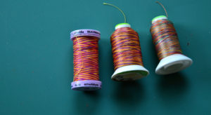 Summer and spring, pink, yellow, and purple colored variegated threads