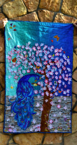 Peacock Paradise fabric art wall hanging - a fabric art project that took us to new levels of quilting dangerously