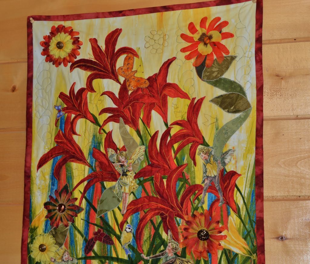 actual trapunto effect instead of quilting foam on a quilted panel with orange lilies and autumn grasses
