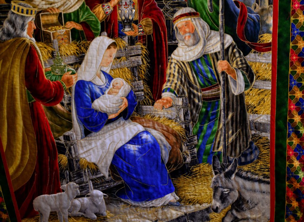 Away in a manger - Christmas small wall hanging, what a completed project of a fabric panel for quilting looks like - close up of Mary, Joseph, and Baby Jesus