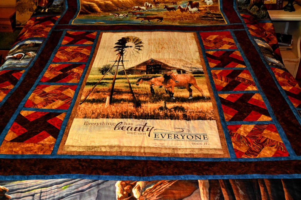 Home Pastures - a project that used printed fabric panels for quilting - close-up of horse pastured printed panel with a windmill