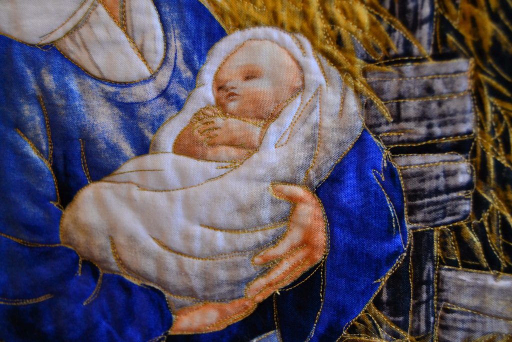 Baby Jesus in Mary's arms panel - quilted using free motion quilting techniques