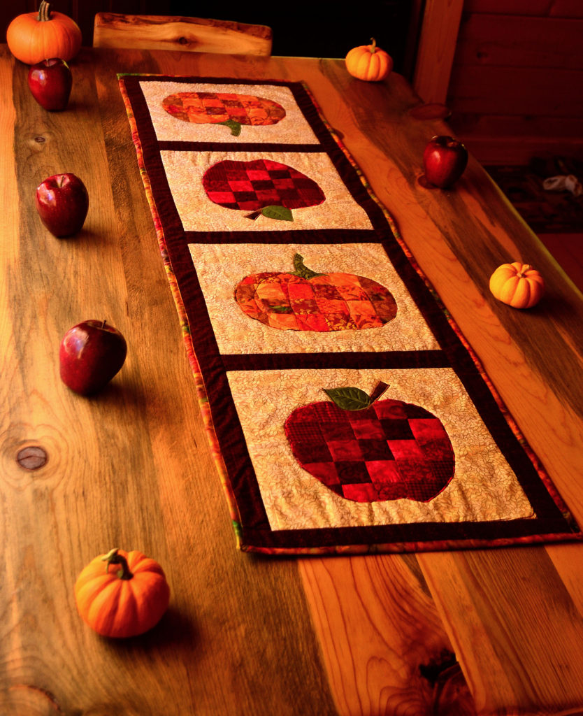 Sweet harvest pumpkin and apple autumn table runner - paperbacked fusible webbing used for sewing appliques on quilts