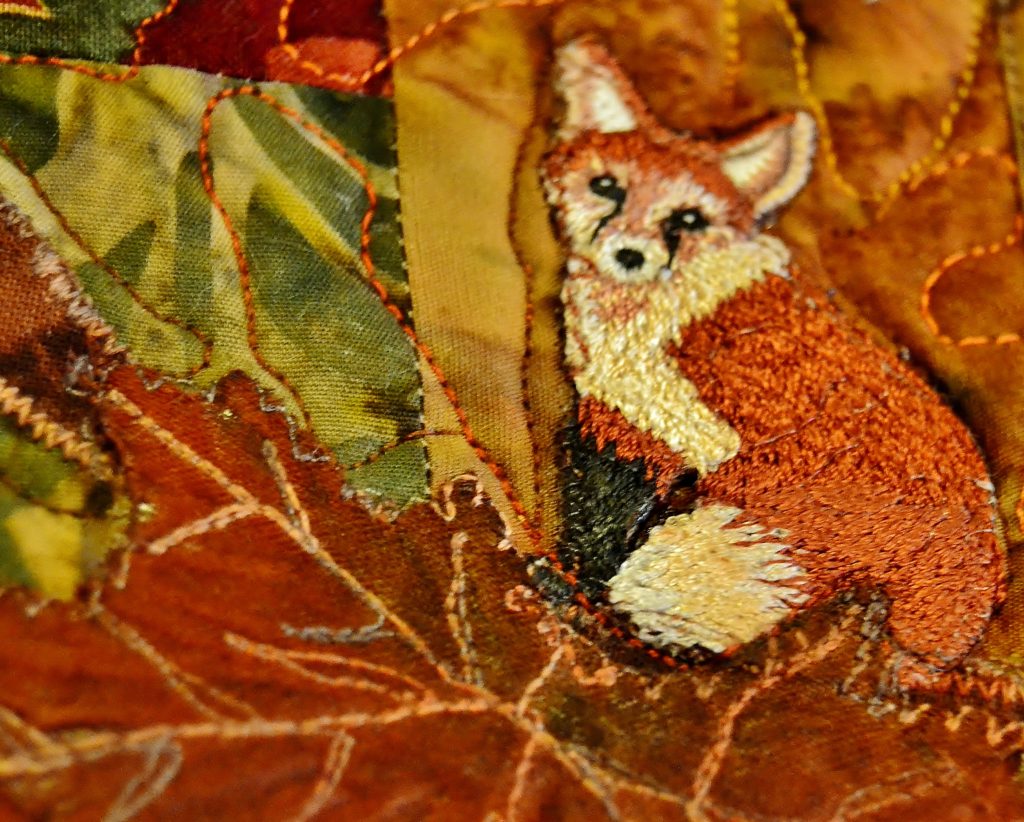 Fox applique on a panel with a zipper back