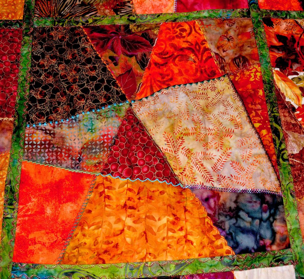 Criss-crossing seams in an autumn crazy quilt