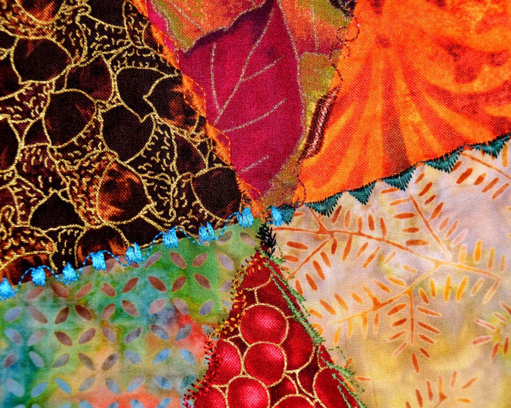 Get Criss-crossing seams in an autumn crazy quilt when you use spray starch for ironing