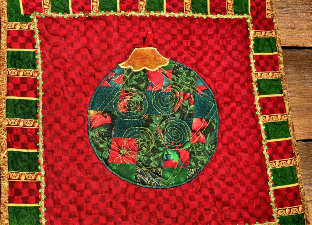 Patchwork green ornament on a bright red background