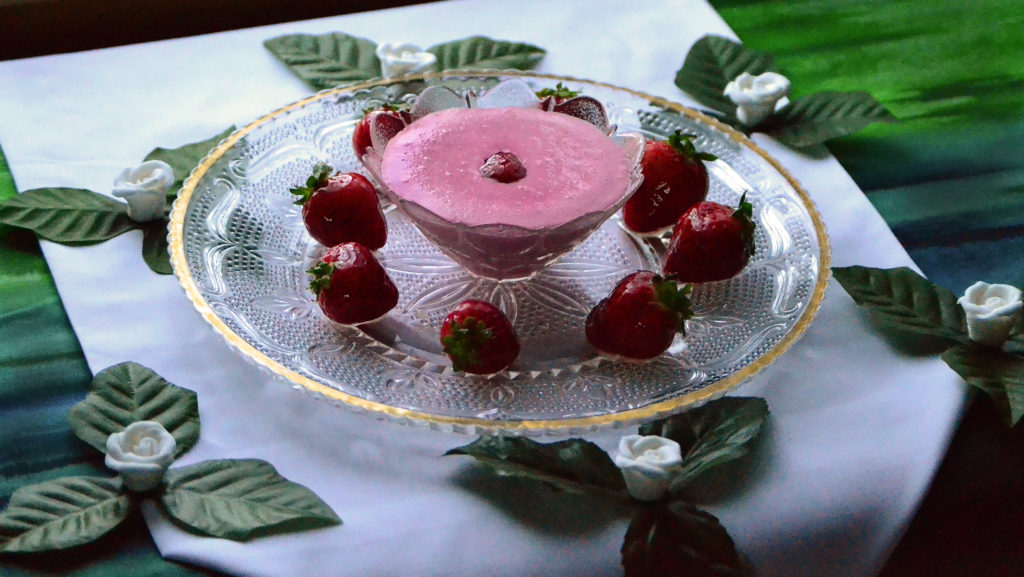 Strawberry smoothie in an elegant crystal dish setting