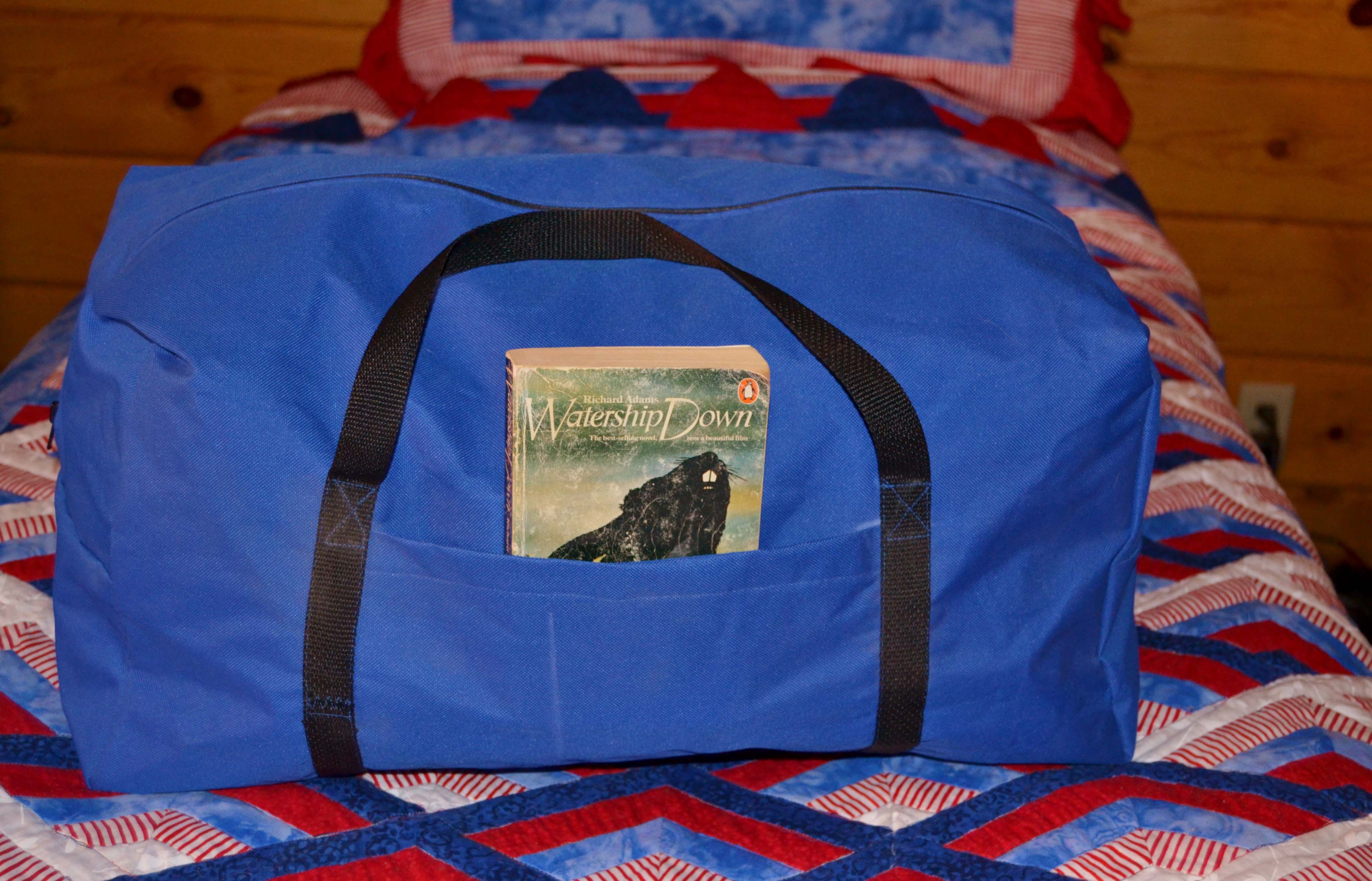 Shows a blue and black custom duffle bag