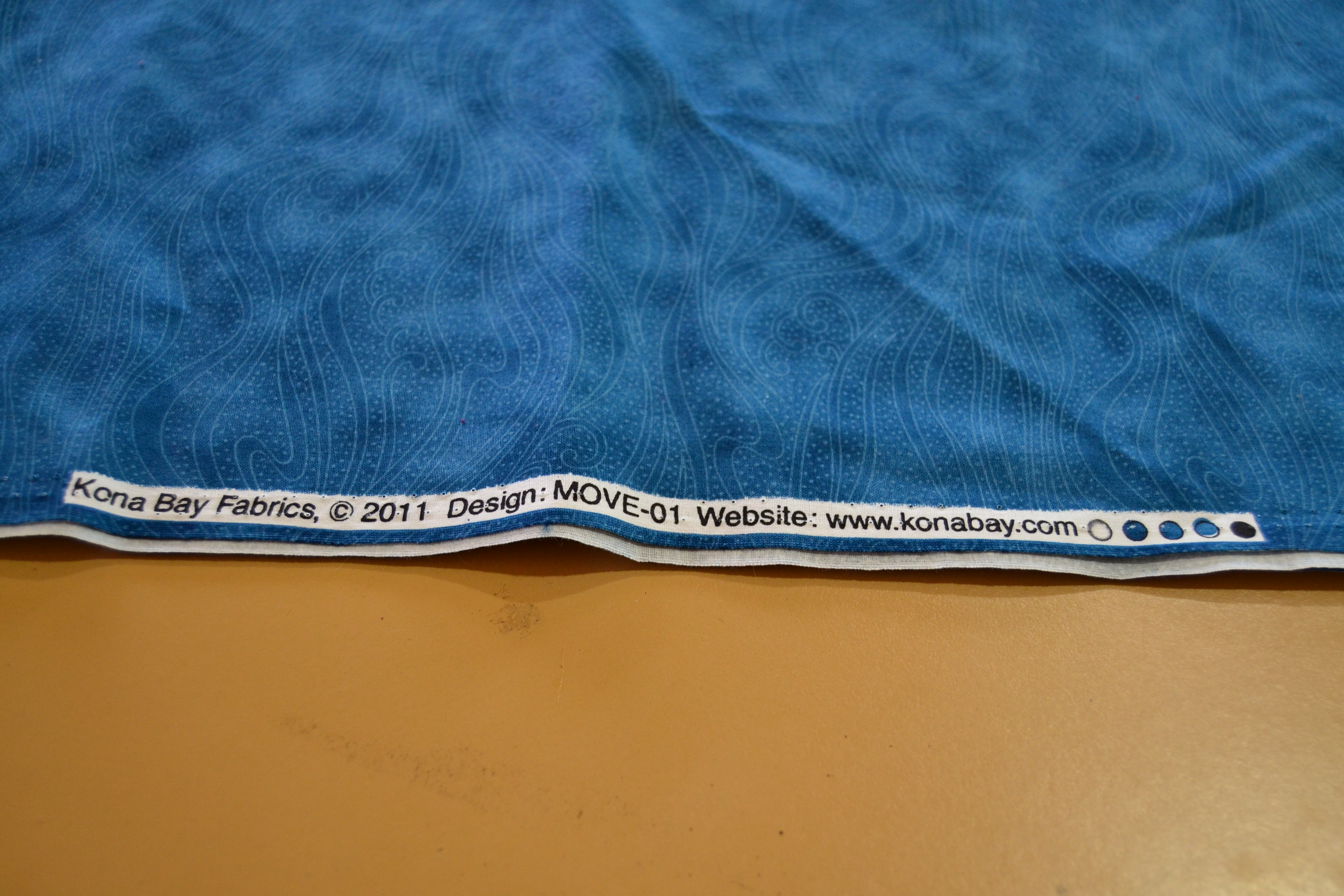 blue fabric with selvage edge showing