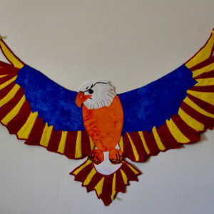 Shaped bald eagle wall hanging with Arizona State flag colors, red, blue, yellow, orange, and white