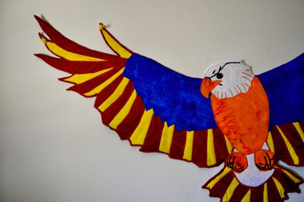 Wing flare of Arizona Flag shaped wall hanging