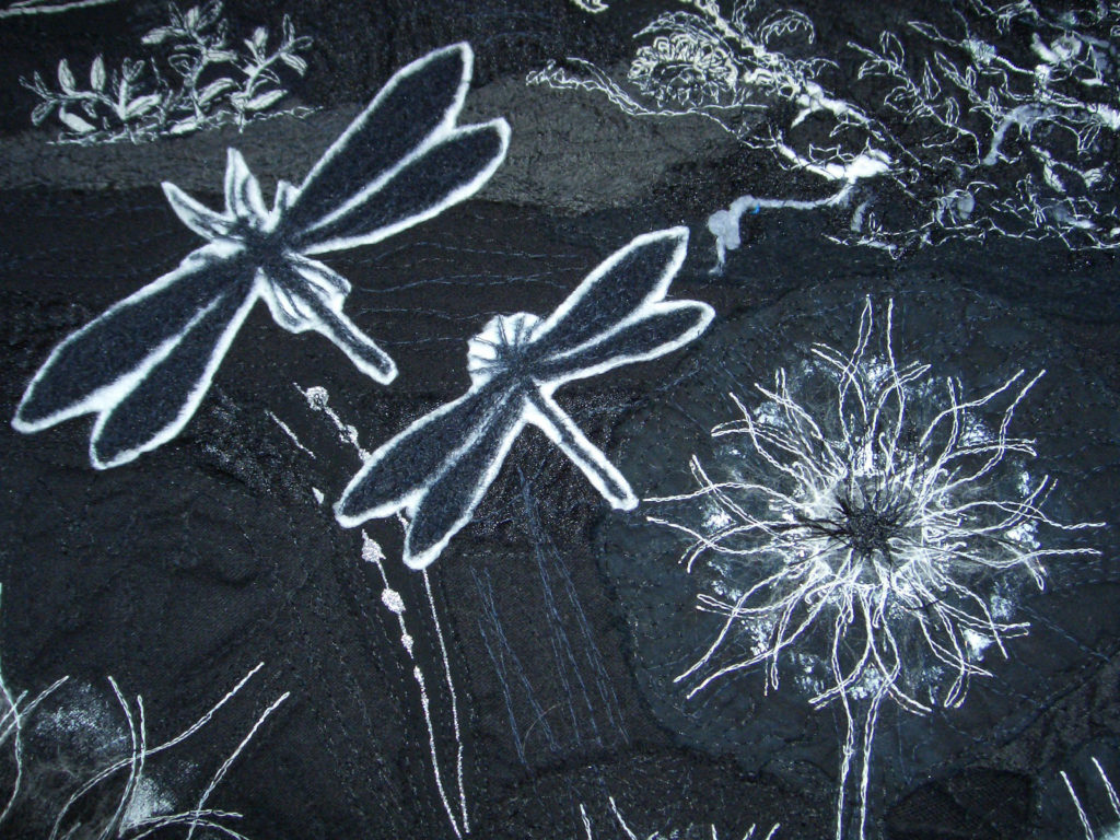 wearable art close up of black and white dragonflies