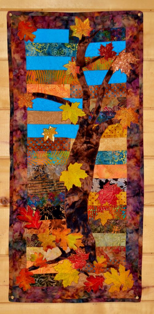 under the spreading maple tree autumn maple tree quilted wall hanging