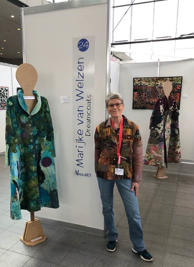 Marijke posing with one of her custom wearable art creations