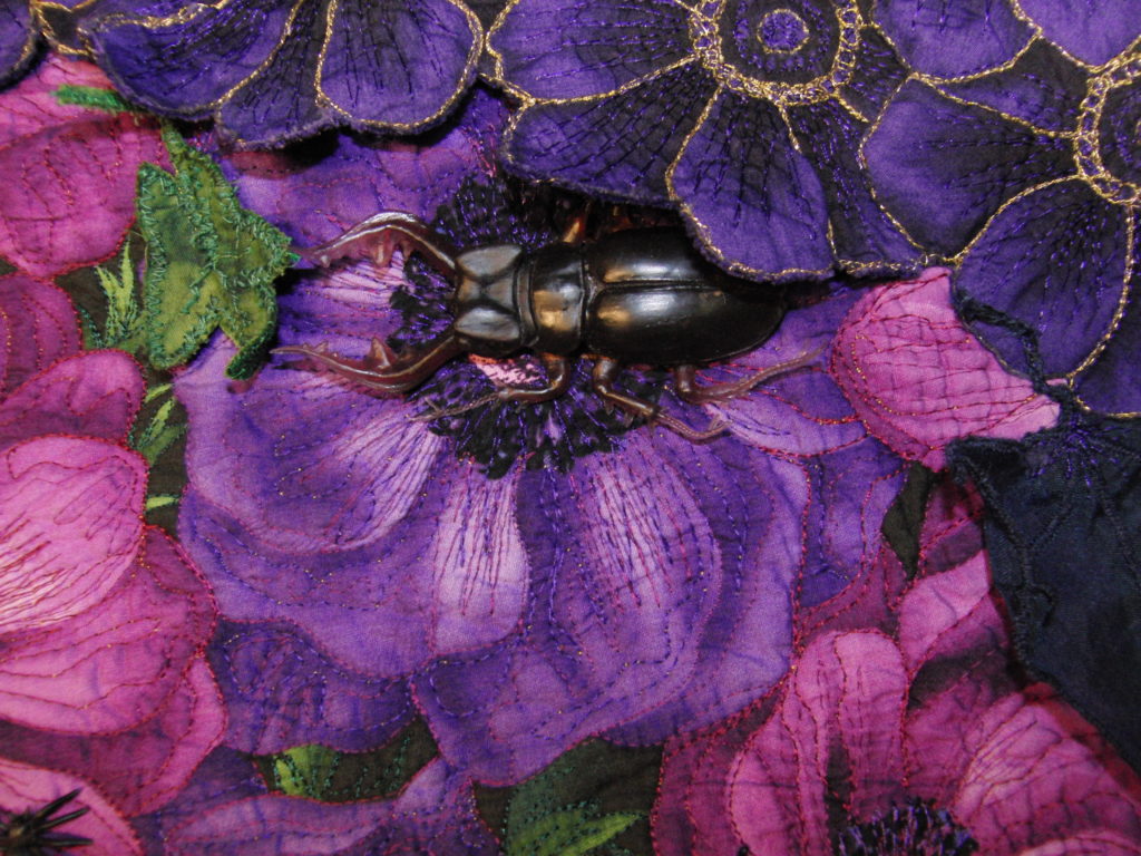 close-up of scarab beetle button accessory