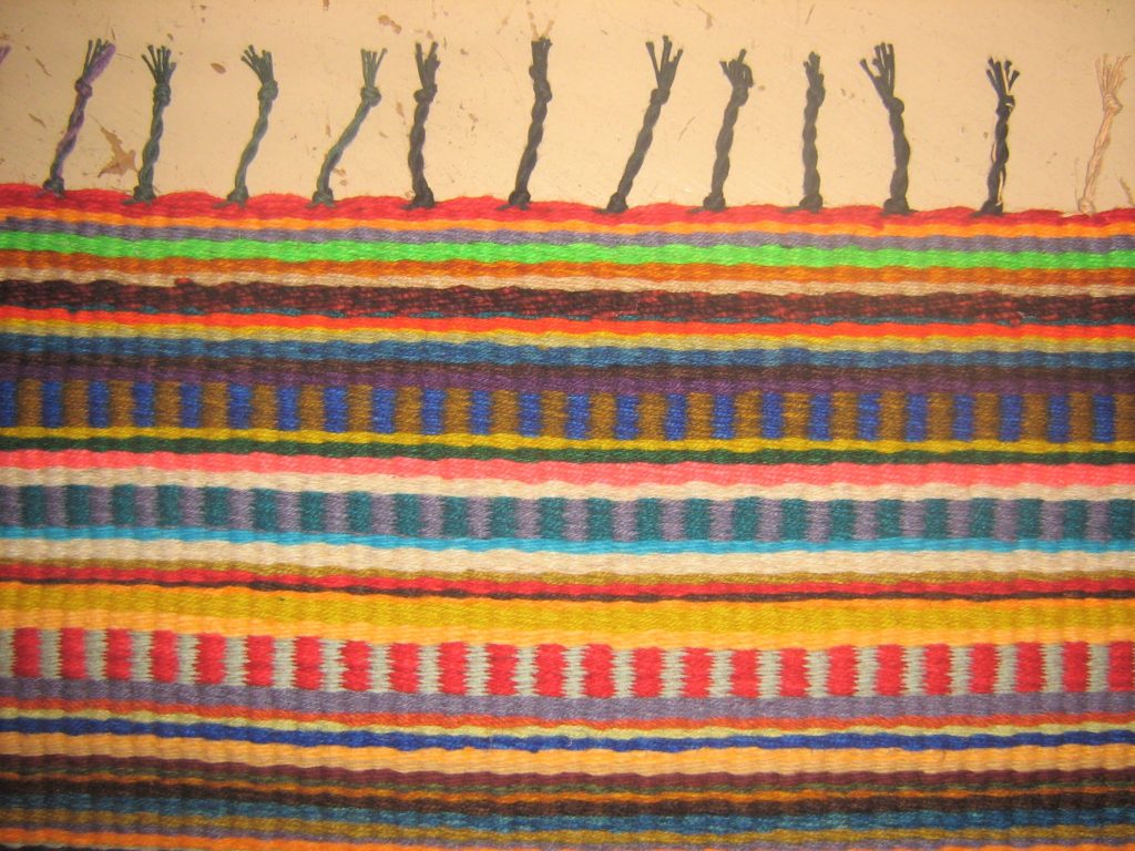 Woven rug fringe