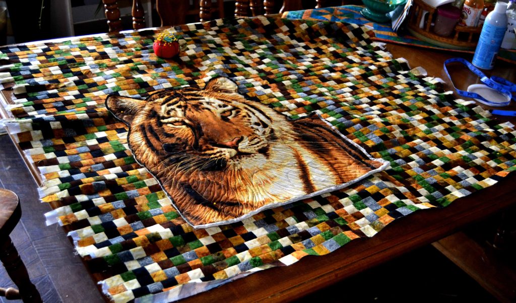 Tiger quilt on a mosaic background