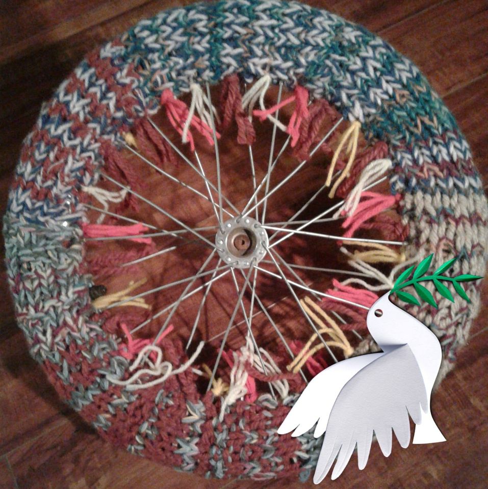Yarnbombing bicycle wheel with the spokes done