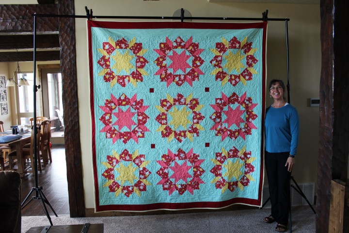 Shawnna Casazza with a big quilt
