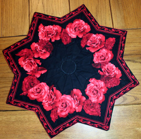 Dramatic black and roses star shaped table topper