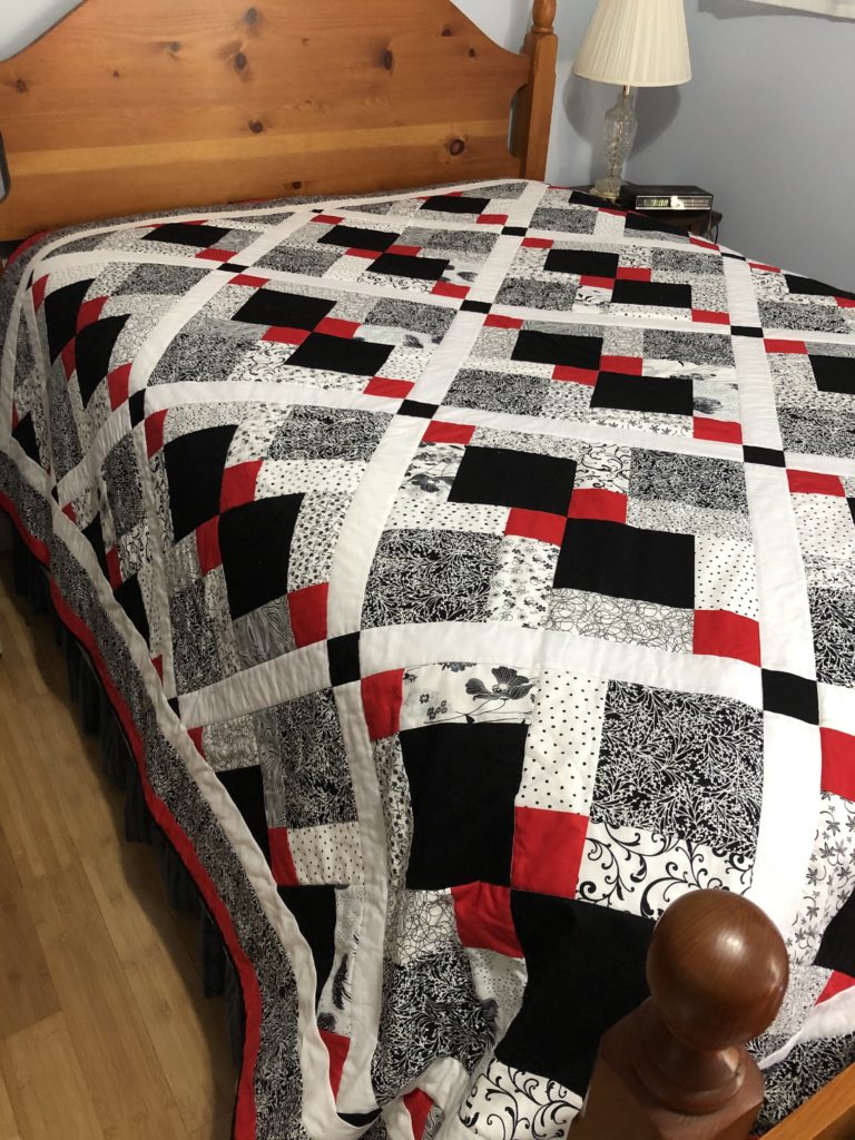 white, black, red, and gray graduation quilt