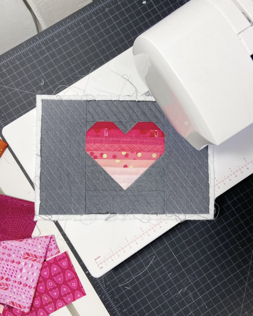 unique geometric quilt designs in miniature - pink pieced heart on a gray background / fabric postcard
